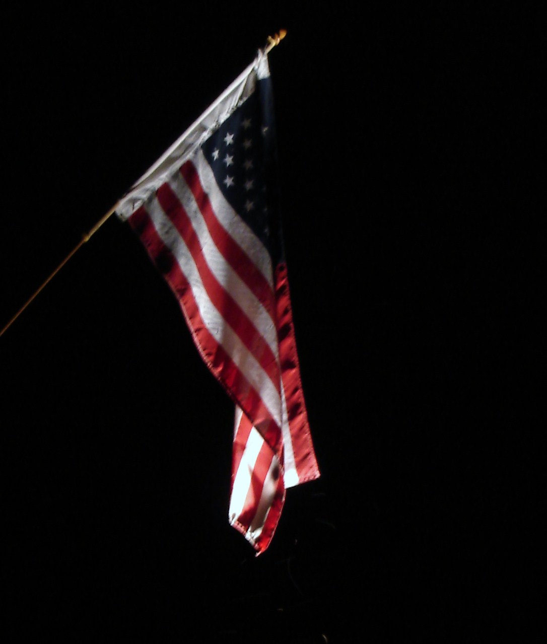 American flag illuminated at night